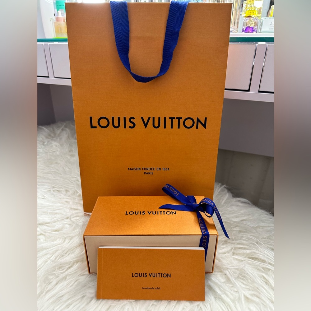 Louis Vuitton sunglass box, care booklet, ribbon and shopping bag.